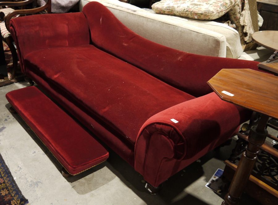 19th century chaise longue / sofa in red upholstery, on turned front legs to brass castors with