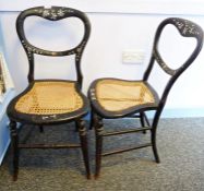 Pair of early 20th century mother-of-pearl inlaid and painted bedroom chairs with cane seats, on