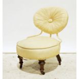 Unusual 19th century low chair with upholstered seat and back, on turned front legs to castors