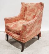 19th century wing back armchair on square section tapering supports to brass castors