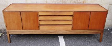 20th century modern teak sideboard in the Danish - style, with four central drawers flanked by