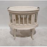 Tray-top display table painted white with lift-out tray, on oval body with glazed door and sides,