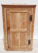 Vintage pine corner cabinet with single door enclosing shelves, 122cm high  Condition Report No