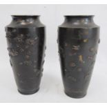 Pair of Japanese and partly gilded bronze vases, each shouldered and tapering, embossed with birds