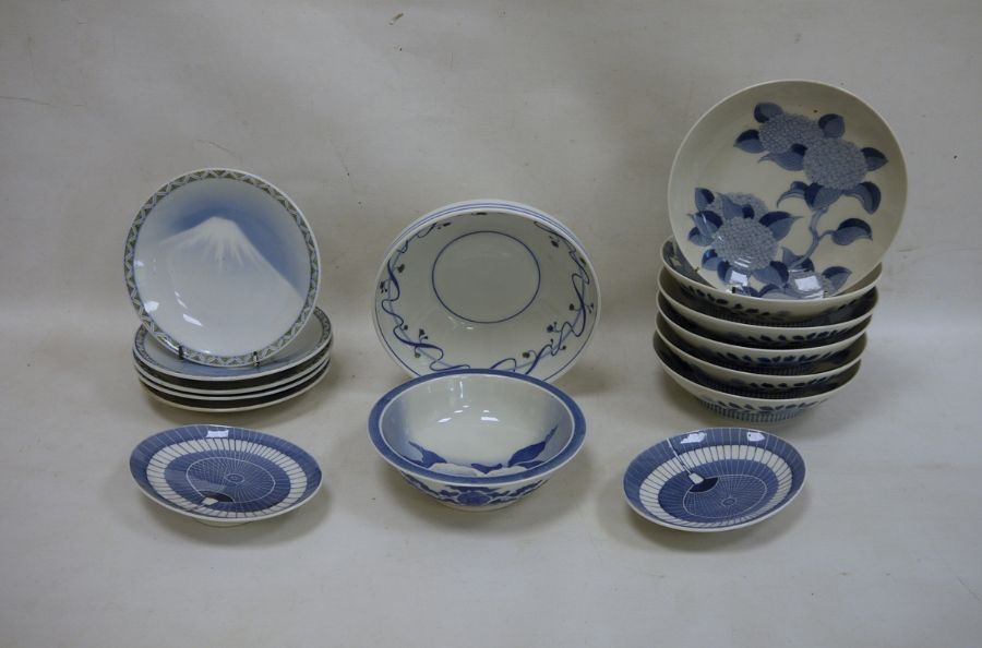 Various modern Oriental blue and white plates and bowls, floral decorated, mountain decorated, fan