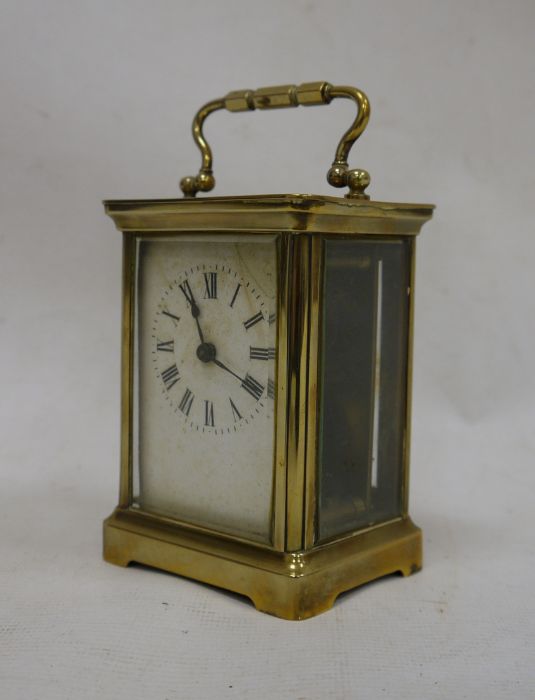 Brass and glass-cased carriage clock with handle