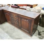 18th century oak low dresser, the rectangular top above three graduated short drawers flanked by