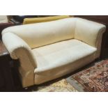 Late Victorian Chesterfield drop-arm sofa in pale yellow diamond patterned upholstery, turned