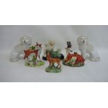 Staffordshire pottery deer, another stag, a spaniel group, a stag with bocage and a pair of china