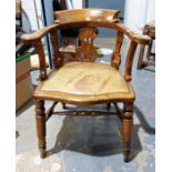 Elm captain's type chair with carved and pierced backsplat, serpentine fronted seat and turned