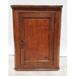 20th century oak wall-hanging corner cupboard with single door enclosing shelves, 89cm high