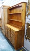 20th century pine dresser with two shelves above three drawers and three cupboard doors, 121cm x