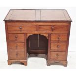19th century mahogany clerk's kneehole desk, the top with two lift-up compartments above eight