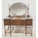 20th century dressing table with oval mirror superstructure above four assorted drawers, on turned