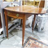 19th century mahogany drop-leaf table on square section tapering supports to brass caps and castors