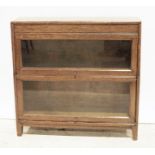 20th century oak sectional bookcase of two sections, on stile supports, 87cm x 83cm