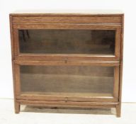 20th century oak sectional bookcase of two sections, on stile supports, 87cm x 83cm