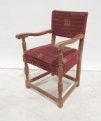 20th century oak armchair, turned and block supports, stretchered base, red ground upholstered