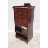 Early 20th century music cabinet with three-quarter galleried top above the five drawers, shelved