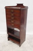 Early 20th century music cabinet with three-quarter galleried top above the five drawers, shelved
