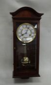 Comitti of London modern mahogany-cased wall clock