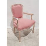 Modern French-style bedroom chair with pink upholstered seat and back, lime-washed frame