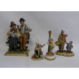 Capodimonte figure group, two tramps reading newspaper, another of man with child and balloon,