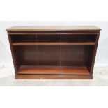 Late 19th/early 20th century mahogany open bookcase, the rectangular top with moulded edge, fluted