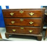 19th century mahogany chest of three drawers, the rectangular top with canted front corners,