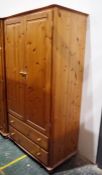 Pair of 20th century pine wardrobes, one with two drawers under (2)