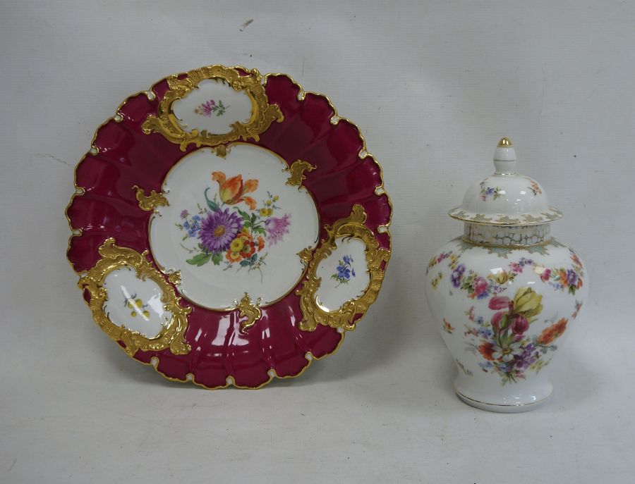 Circular floral and gilt decorated dish with blue cross swords mark to reverse, 30cm high and a