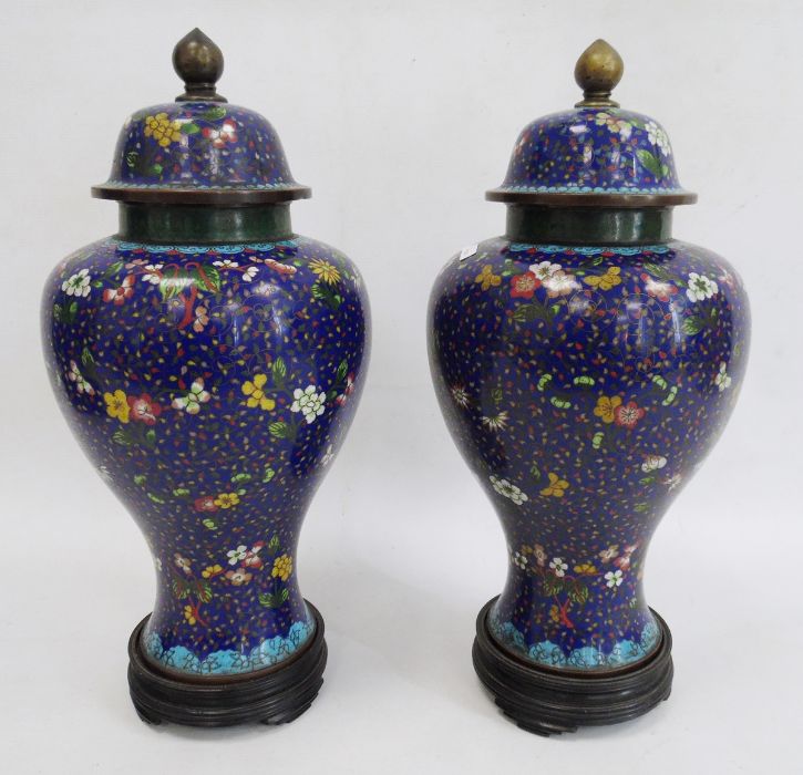 Pair Chinese cloisonne enamel inverse baluster vases, each with high domed cover and allover