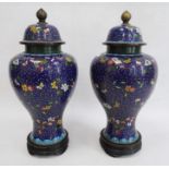 Pair Chinese cloisonne enamel inverse baluster vases, each with high domed cover and allover