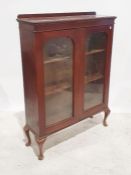 20th century mahogany two-door glazed cabinet, the rectangular top with moulded cornice above two