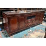 Modern Chinese hardwood lounge unit, rectangular top above assorted drawers and cupboard doors,