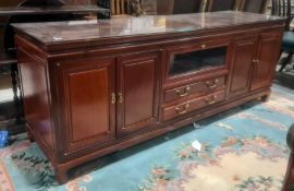 Modern Chinese hardwood lounge unit, rectangular top above assorted drawers and cupboard doors,