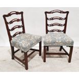 Pair of Georgian-style ladderback dining chairs with carved and pierced decoration, upholstered