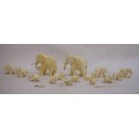 Collection of carved ivory elephants, lions, etc, graduated, largest 8.5cm high (1 box)