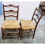 Pair of early 20th century ladderback chairs with rush seats, on turned stretchers and supports (2)
