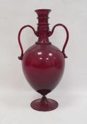 Ruby glass two-handled vase with knopped neck, pair scroll handles to the ovoid tapering body, on