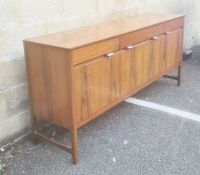 Nathan teak Caspian range sideboard, the rectangular top above three drawers, two cupboard doors and