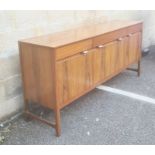 Nathan teak Caspian range sideboard, the rectangular top above three drawers, two cupboard doors and