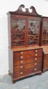 George III mahogany secretaire bookcase with swan-neck pediment above astragal glazed doors