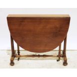 19th century walnut drop-leaf table on twin end column supports united by stretcher