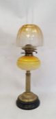 Victorian yellow glass and brass oil lamp, having amber and clear shade, mottled yellow well, with