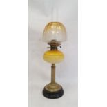 Victorian yellow glass and brass oil lamp, having amber and clear shade, mottled yellow well, with