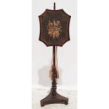19th century mahogany framed polescreen with needlework floral spray, on turned support and
