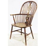 Elm-seated wheelback Windsor-type elbow chair on turned supports and stretcher