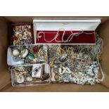 Quantity of costume jewellery to include brooches, clip-on earrings, beaded necklaces, etc (1 box)