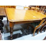 Large 20th century extending dining table, the rectangular top with rounded corners, on turned